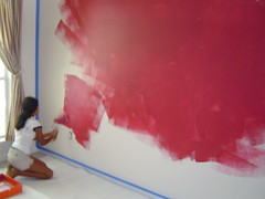 Mianna painting the cranberry wall